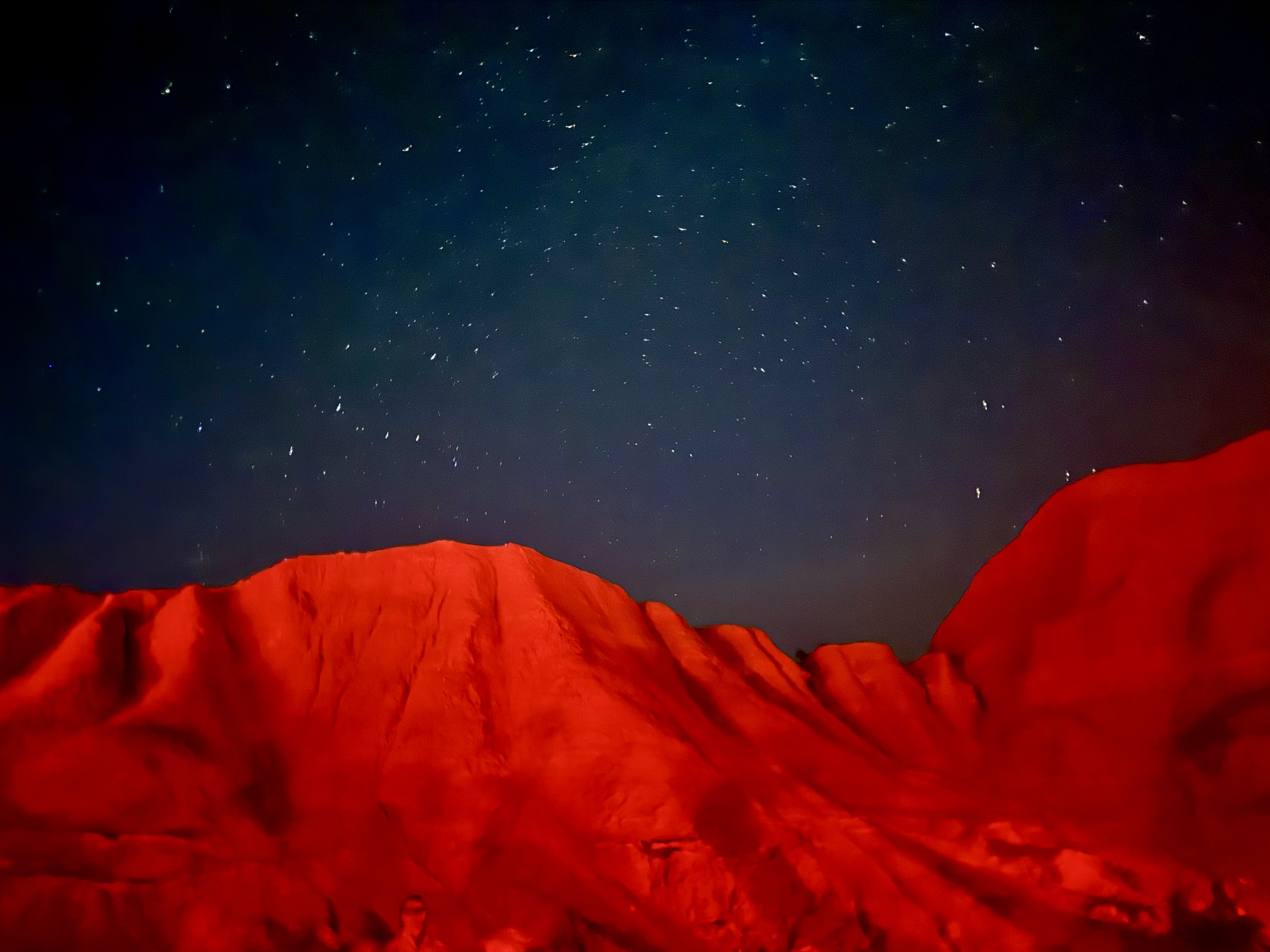 The Badlands under red festival lights at Astrofest